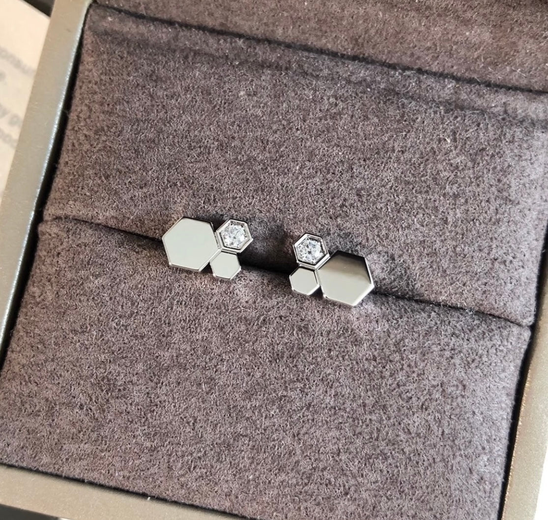 Martin Graham stud earrings in polished metal-tone – close-up detail
