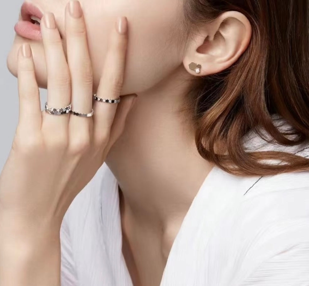 Martin Graham stud earrings in polished metal-tone – front product view