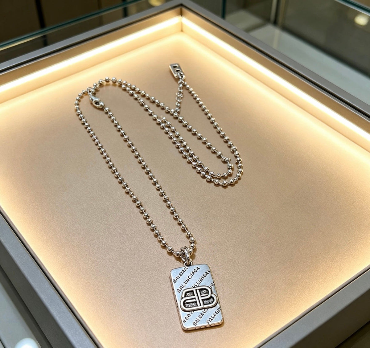Martin Graham pendant necklace in polished metal-tone – front product view