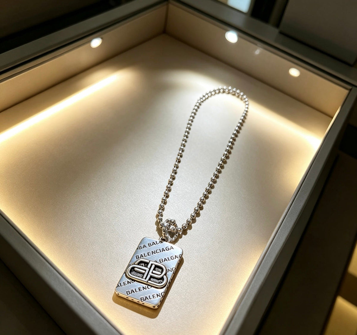 Martin Graham pendant necklace in polished metal-tone – detail view
