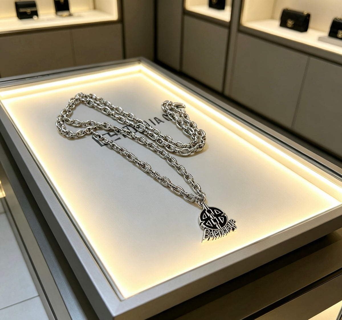 Martin Graham pendant necklace in polished metal-tone – detail view