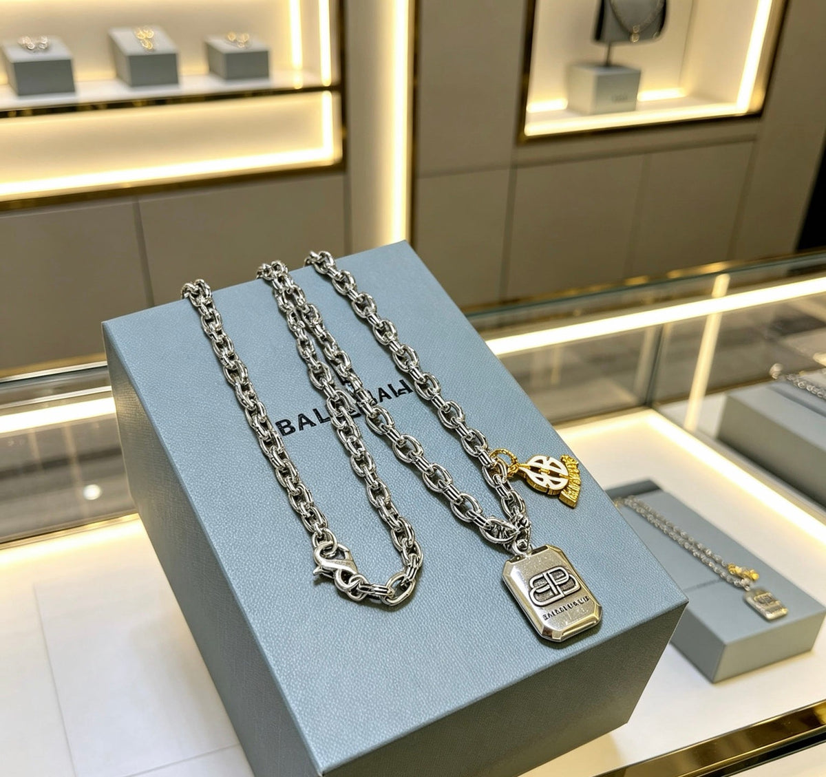 Martin Graham pendant necklace in polished metal-tone – side detail