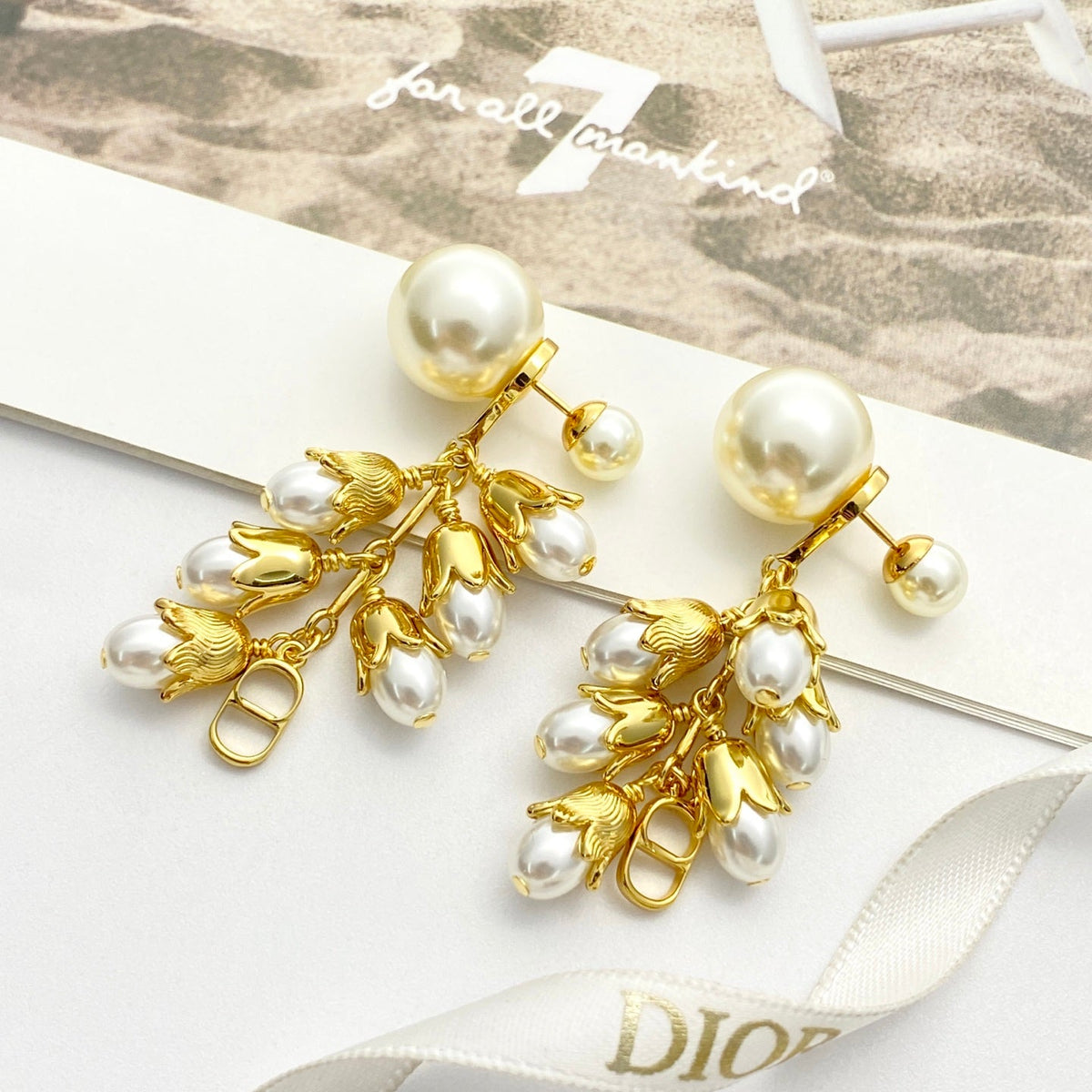 Martin Graham stud earrings in polished metal-tone – front view