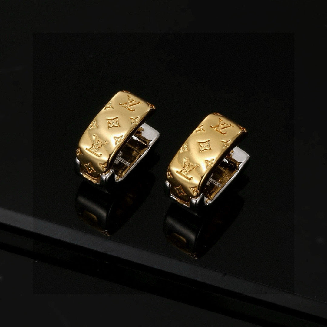 Martin Graham stud earrings in polished metal-tone – close-up detail