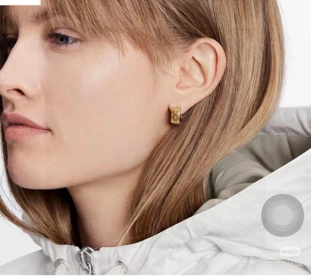 Martin Graham stud earrings in polished metal-tone – styled product view