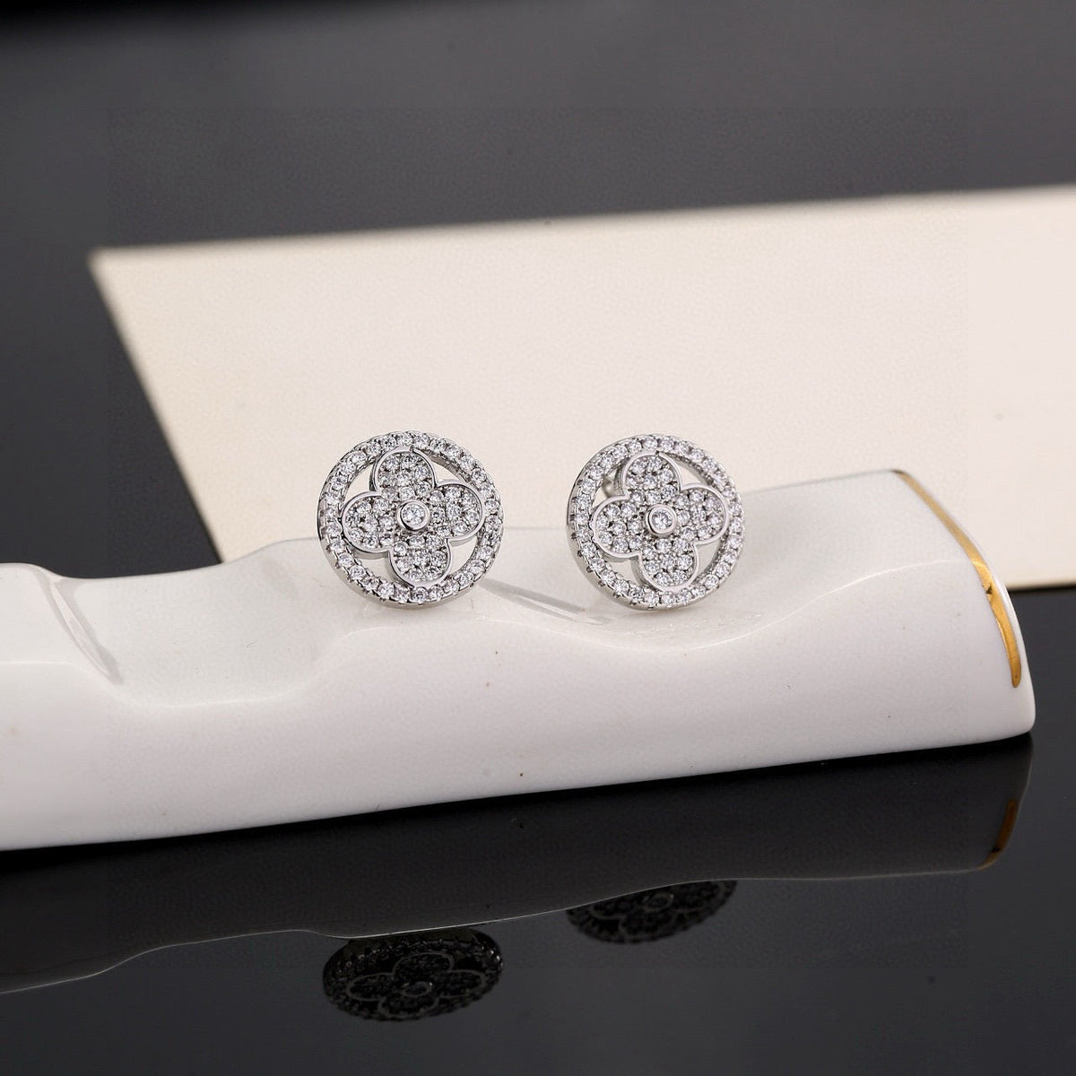 Martin Graham stud earrings in polished metal-tone – styled product view
