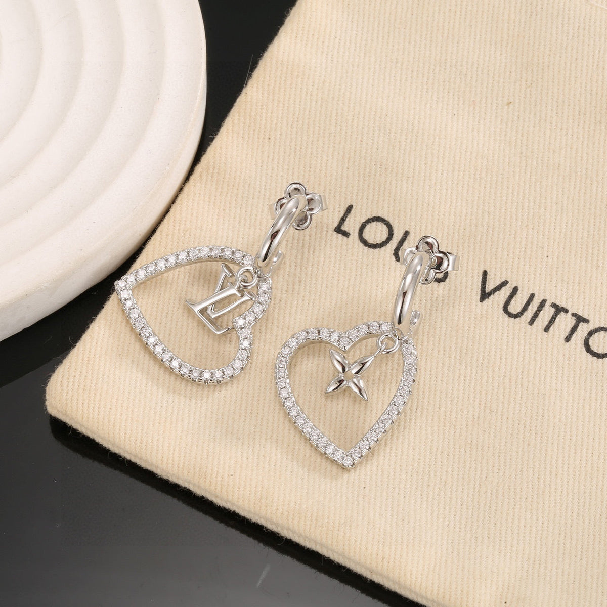 Martin Graham stud earrings in polished metal-tone – side detail