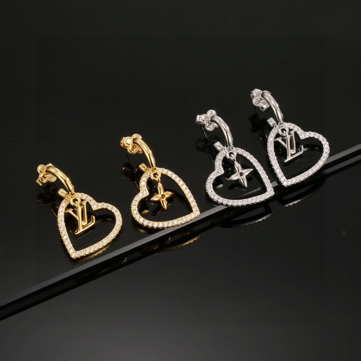 Martin Graham stud earrings in polished metal-tone – close-up detail