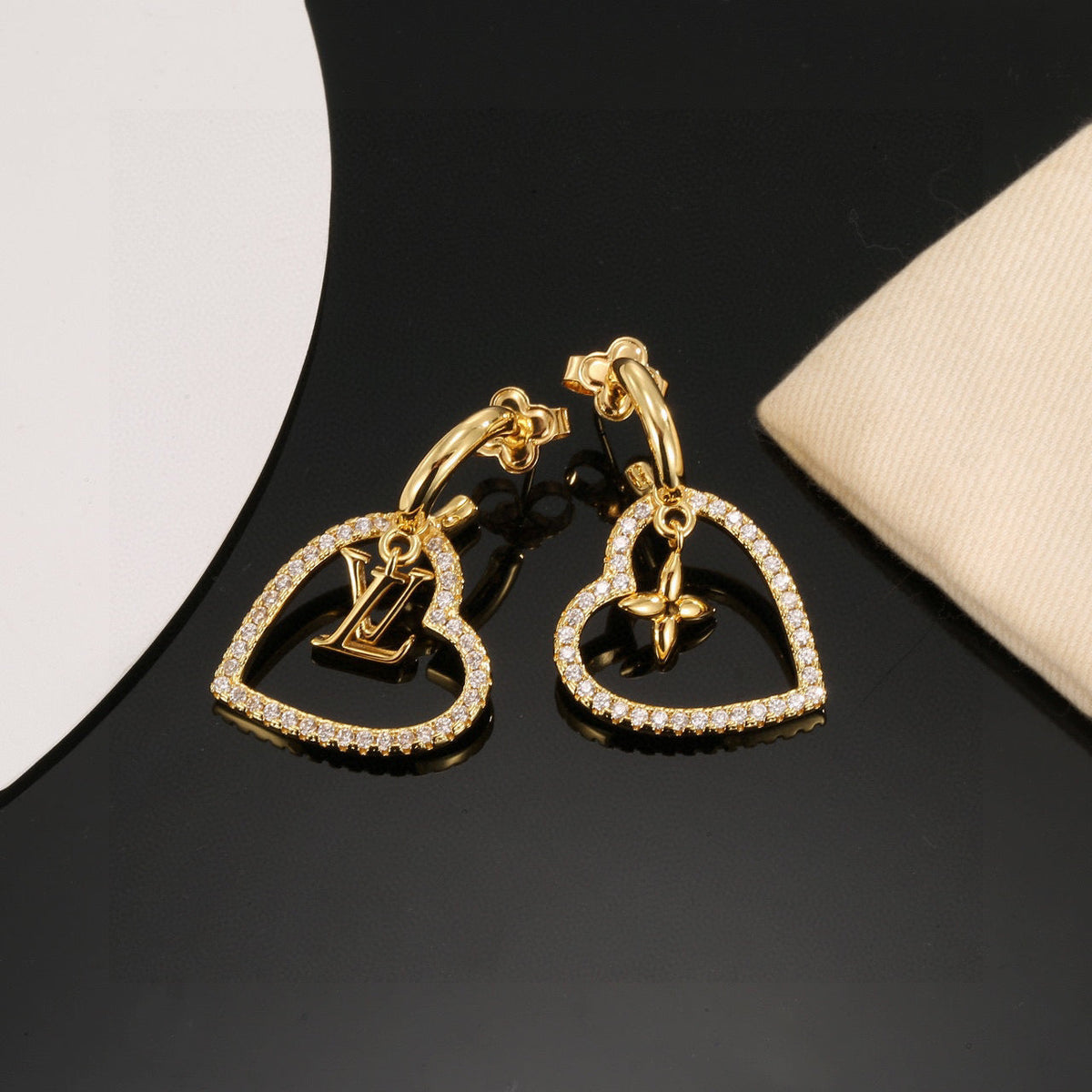 Martin Graham stud earrings in polished metal-tone – front product view