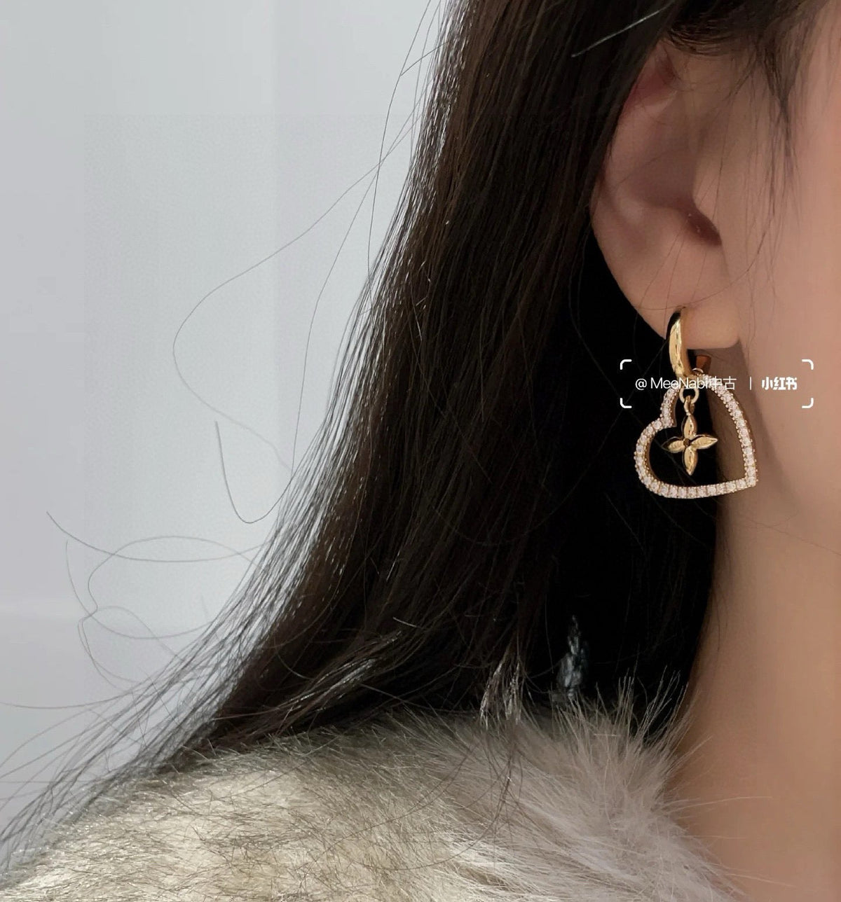 Martin Graham stud earrings in polished metal-tone – detail view