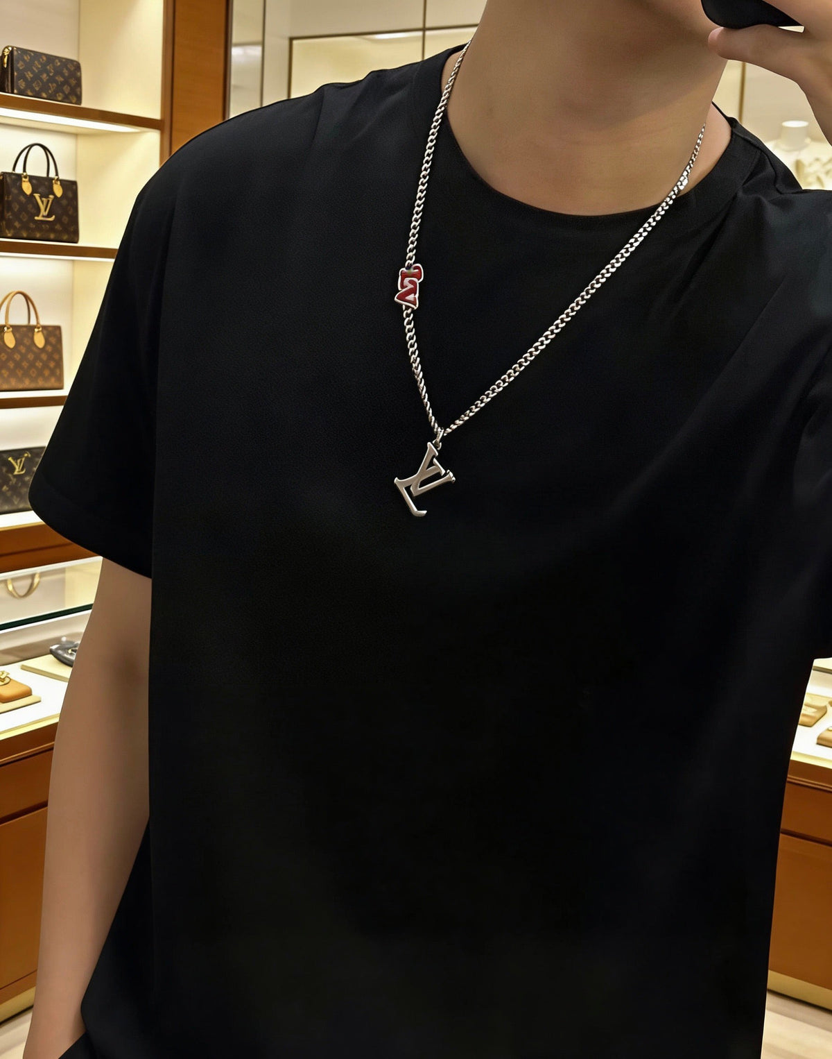 Martin Graham pendant necklace in polished metal-tone – side detail