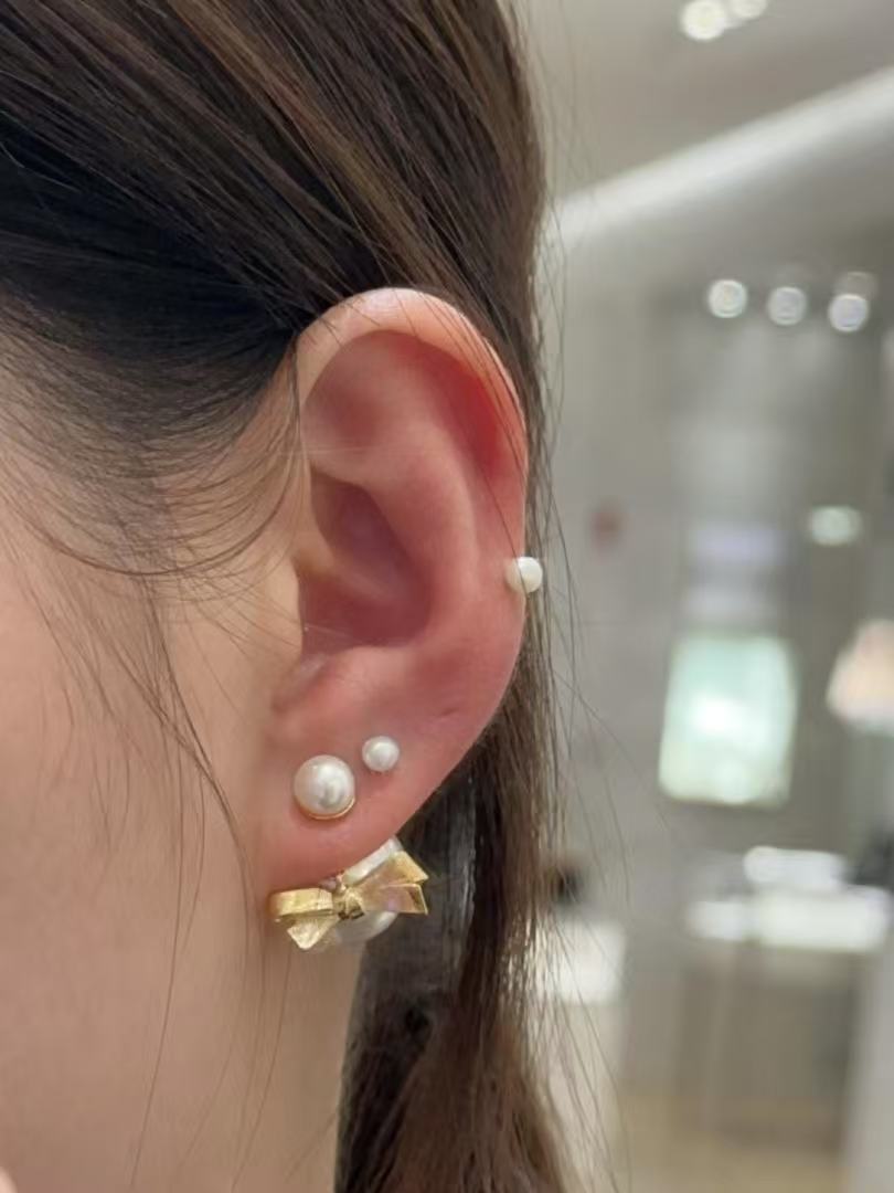 Martin Graham earrings in polished metal-tone – front view