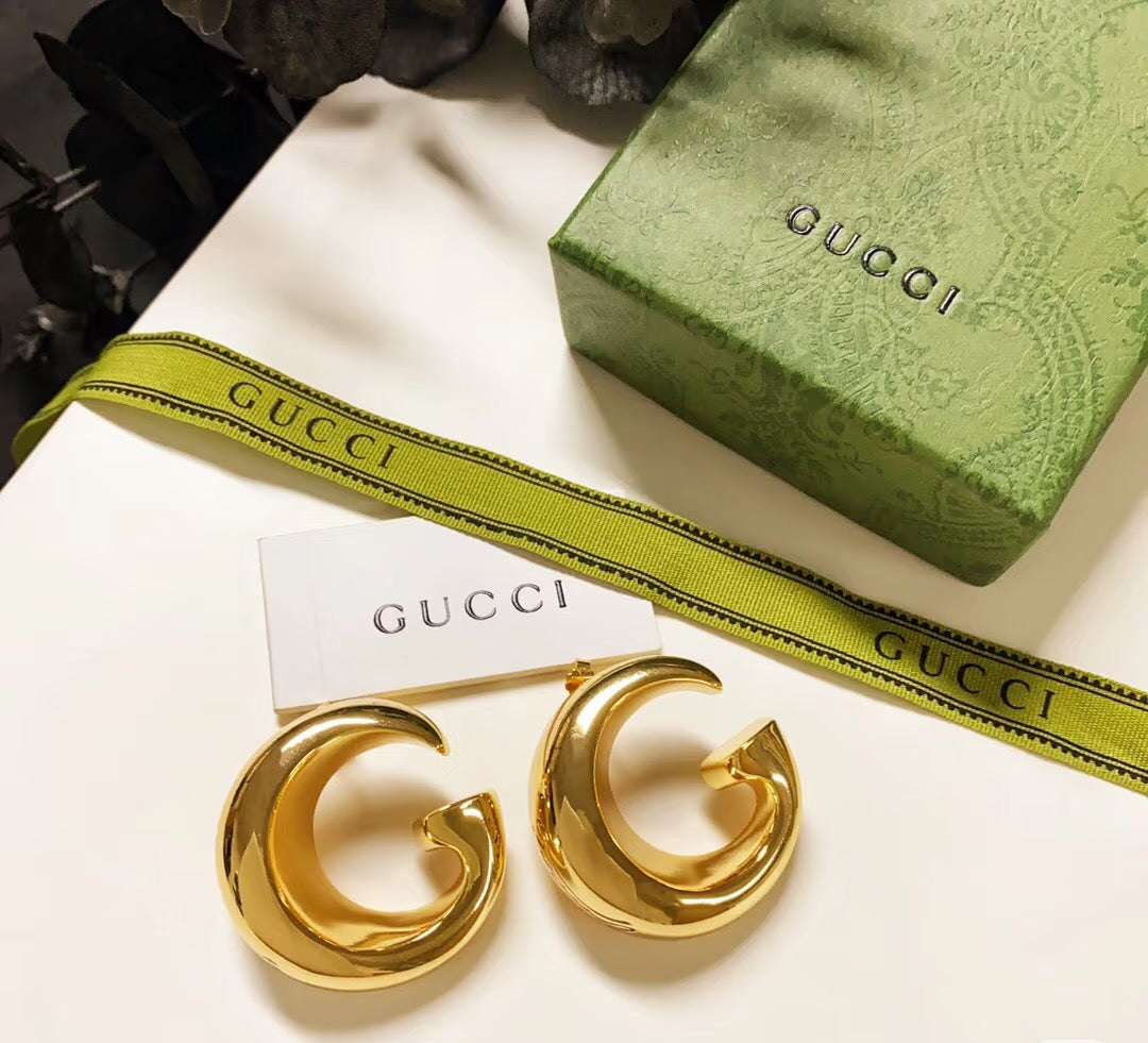 Martin Graham stud earrings in polished metal-tone – detail view