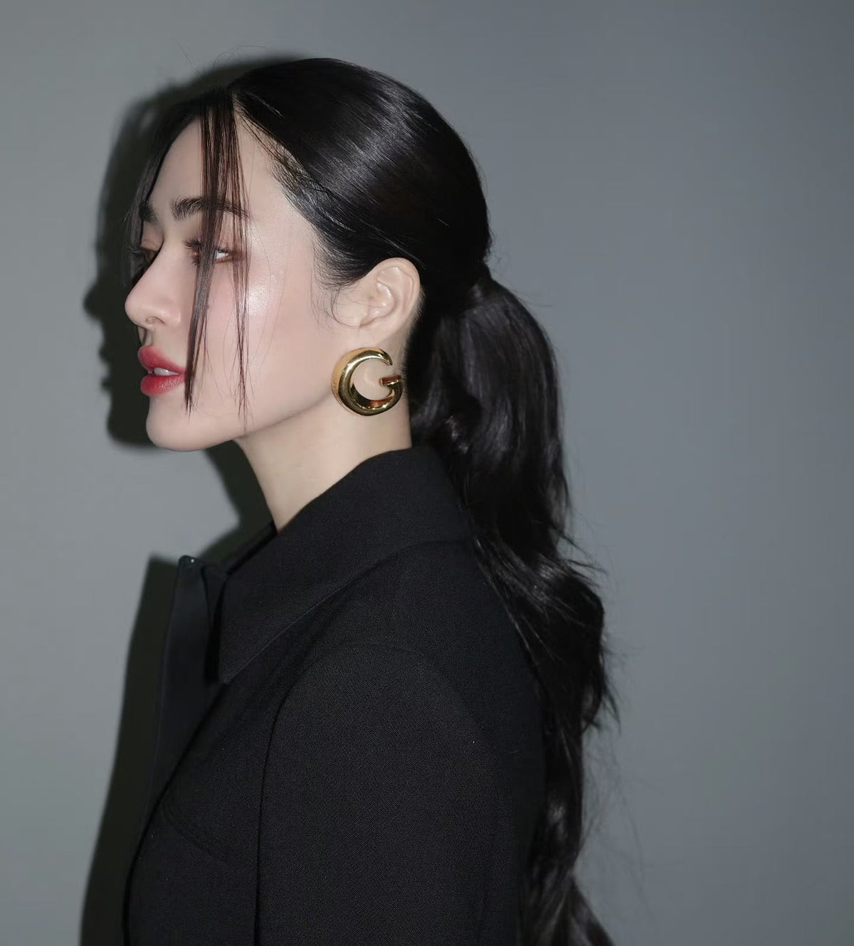 Martin Graham stud earrings in polished metal-tone – styled product view