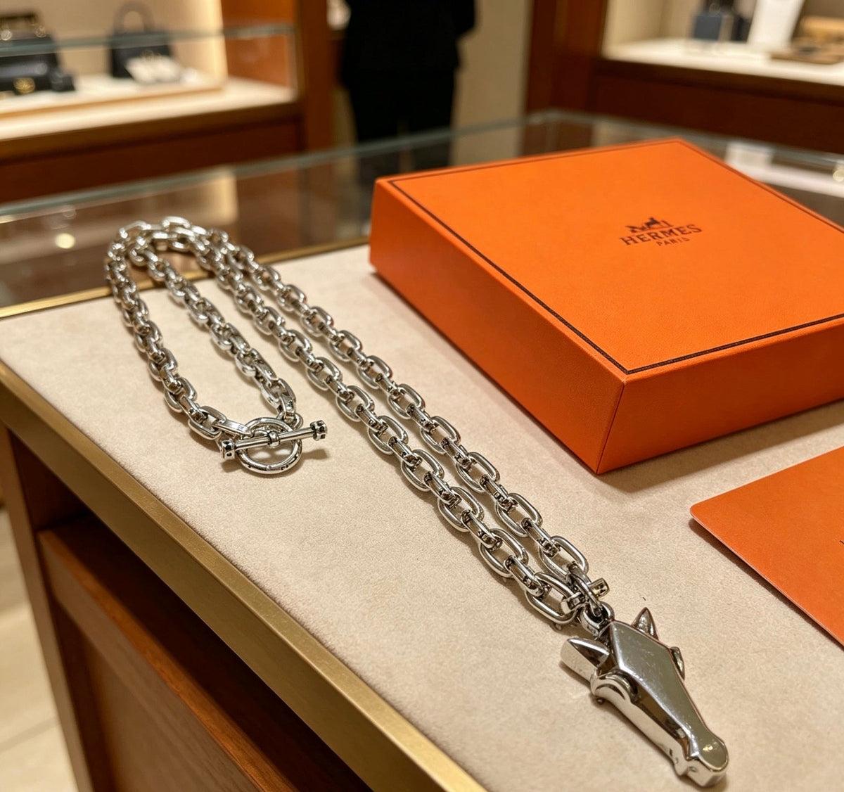 Martin Graham pendant necklace in polished metal-tone – close-up detail