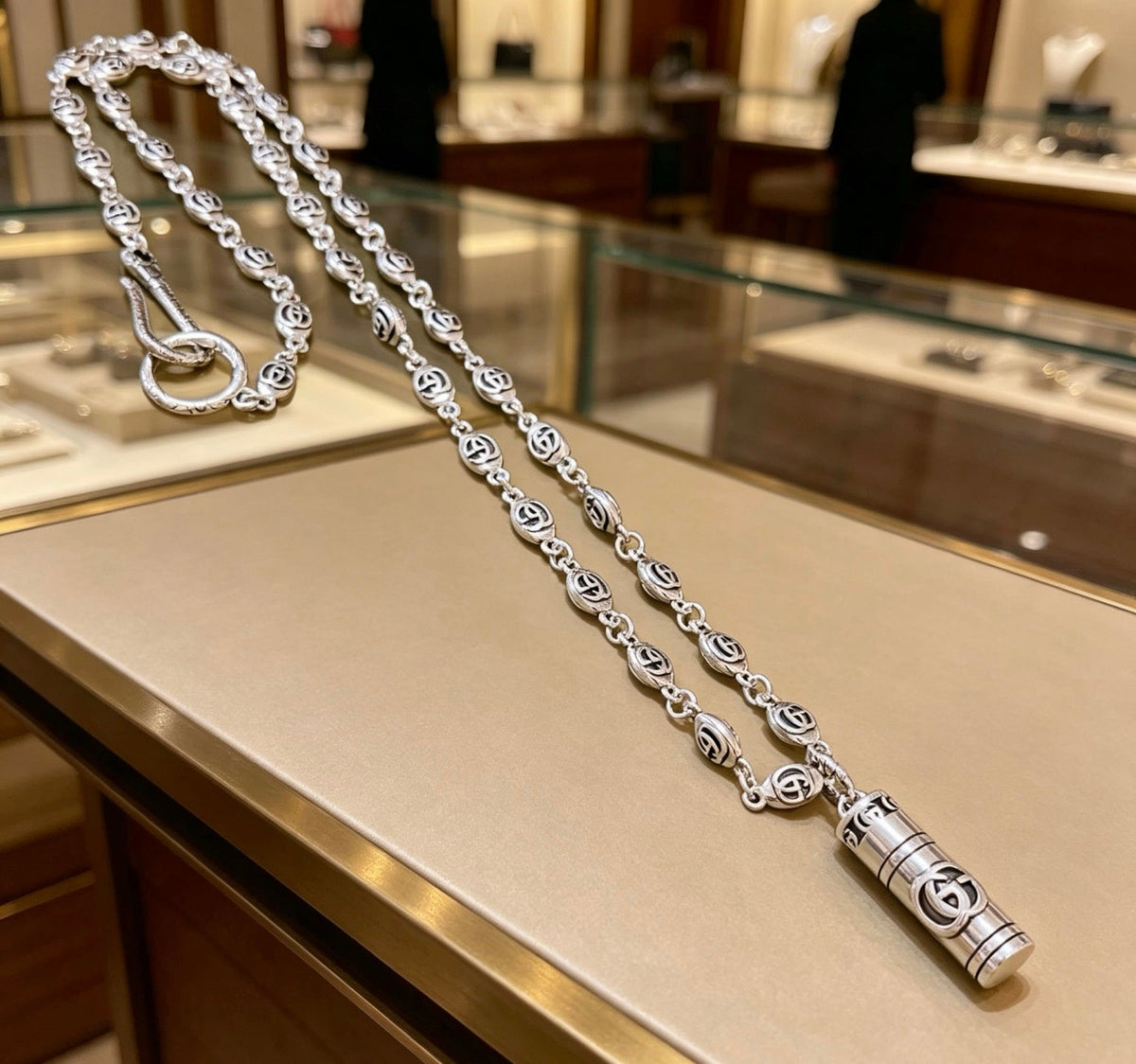 Martin Graham pendant necklace in polished metal-tone – front product view