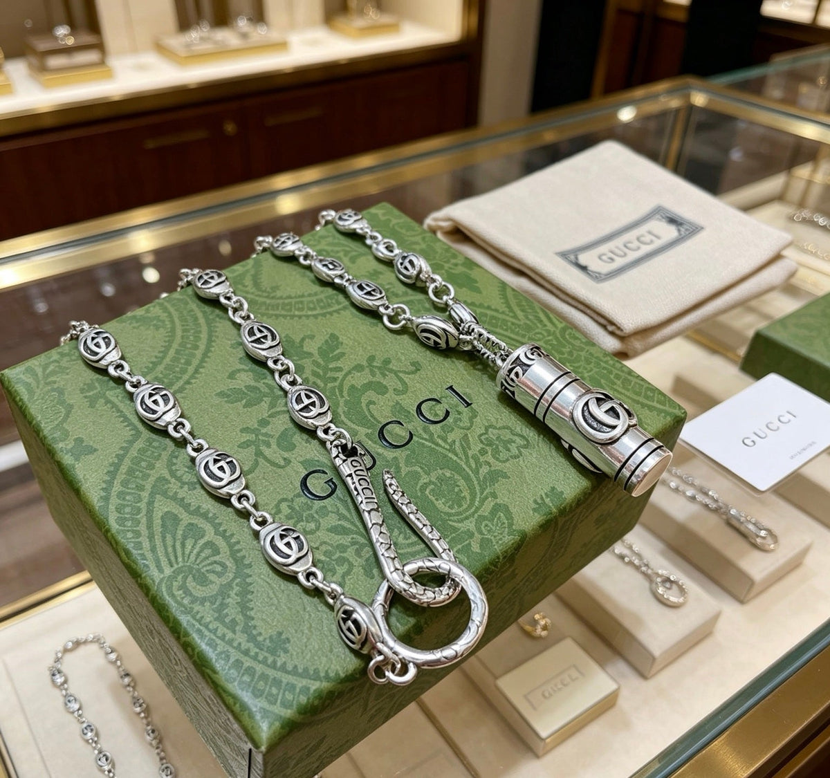 Martin Graham pendant necklace in polished metal-tone – side detail