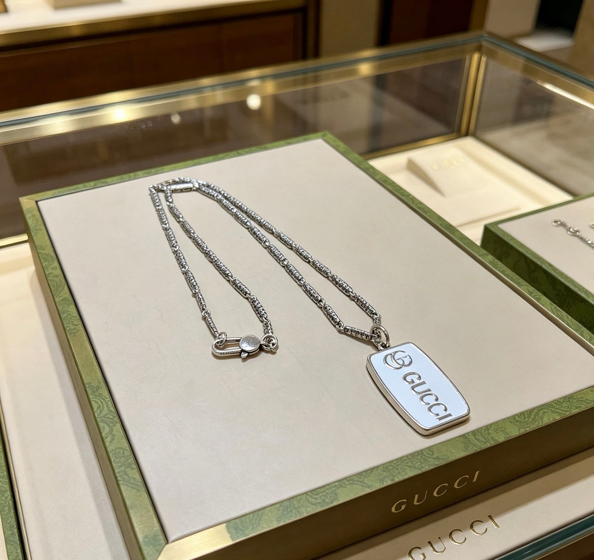 Martin Graham pendant necklace in polished metal-tone – front product view