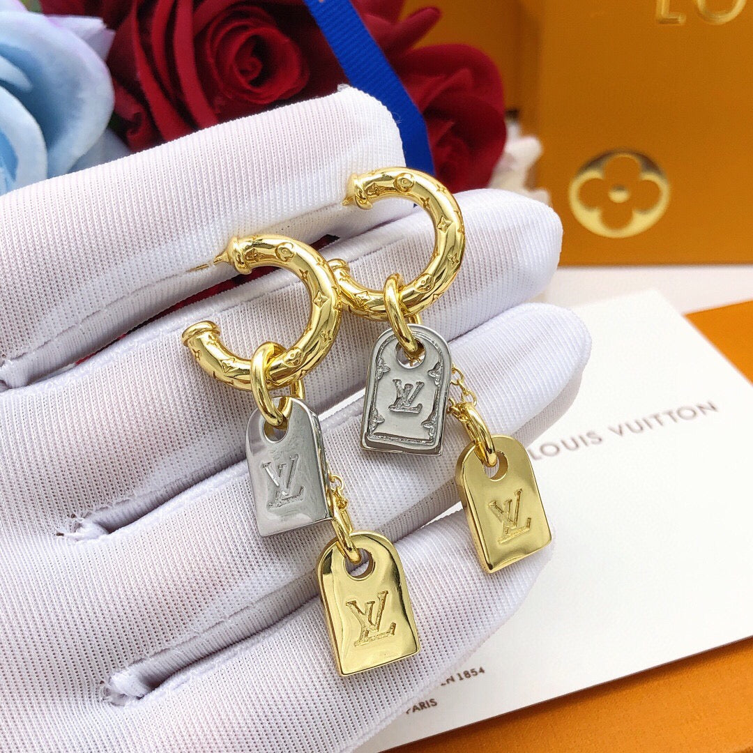 Martin Graham stud earrings in polished metal-tone – front product view