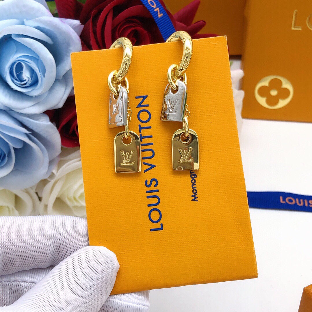 Martin Graham stud earrings in polished metal-tone – styled product view