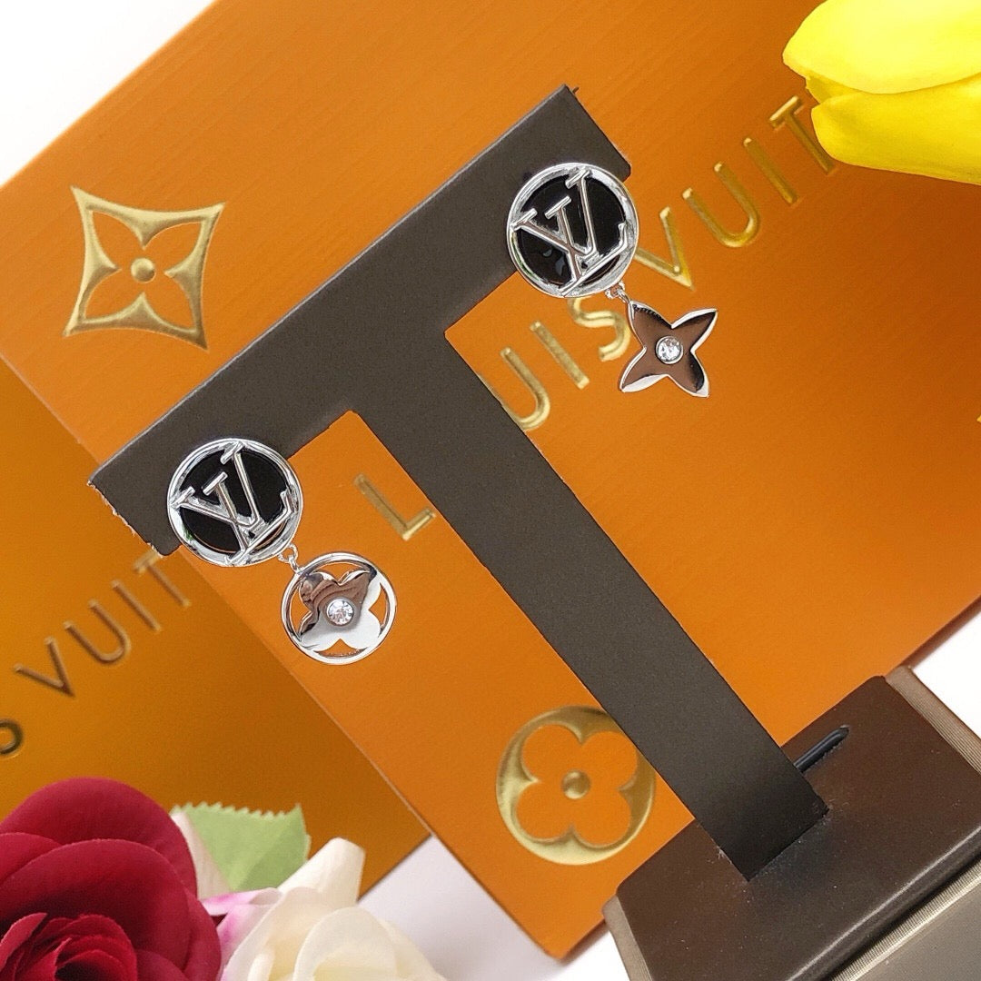 Martin Graham stud earrings in polished metal-tone – close-up detail