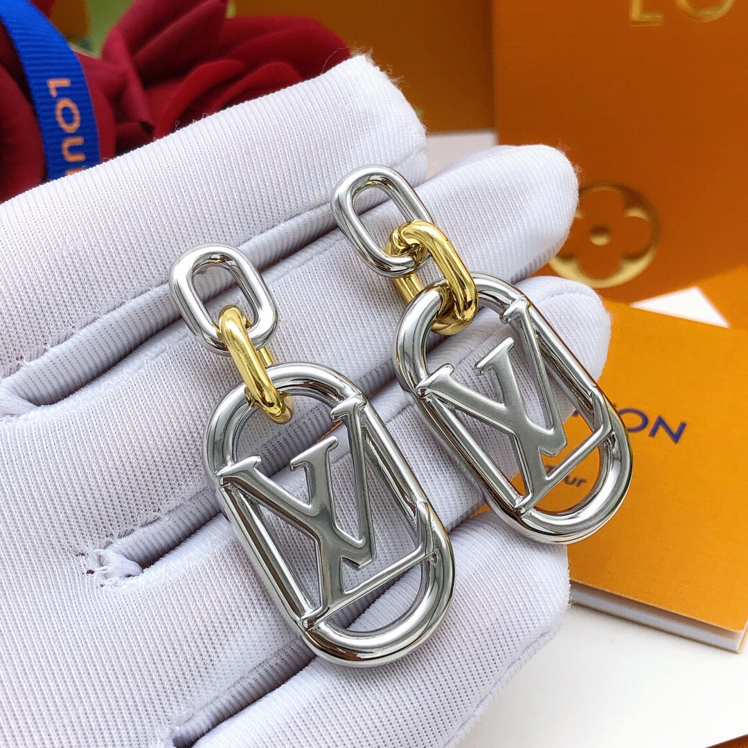 Martin Graham stud earrings in polished metal-tone – close-up detail