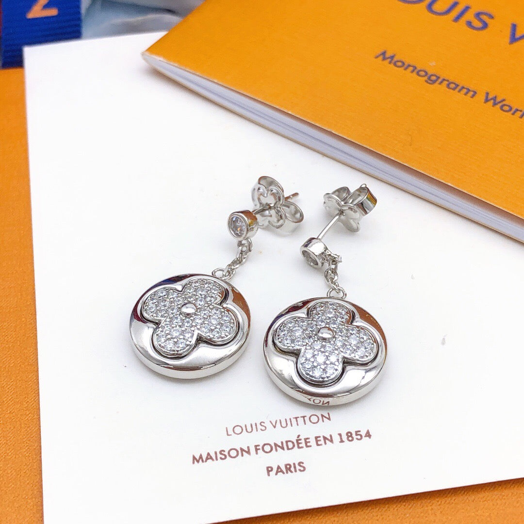 Martin Graham stud earrings in polished metal-tone – detail view