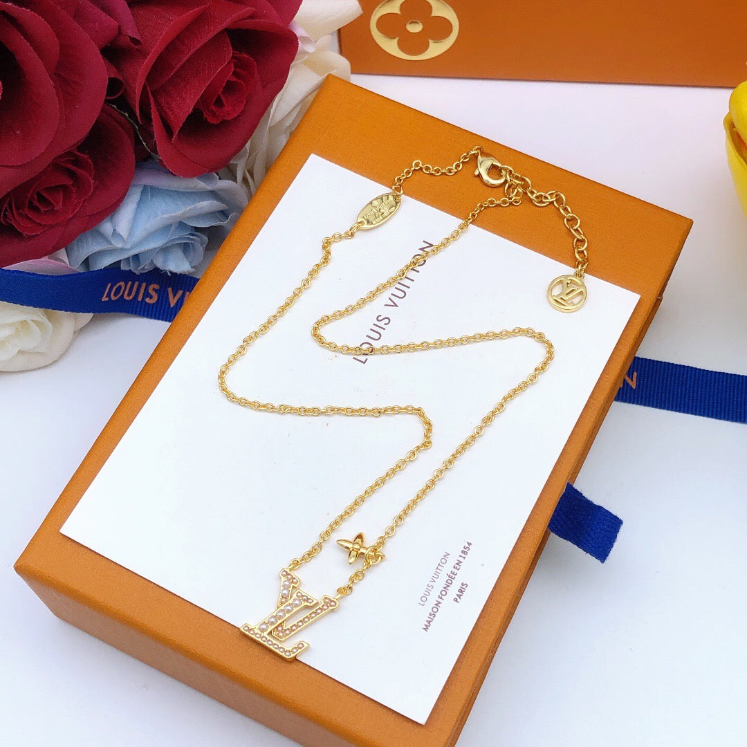 Martin Graham pendant necklace in polished metal-tone – close-up detail