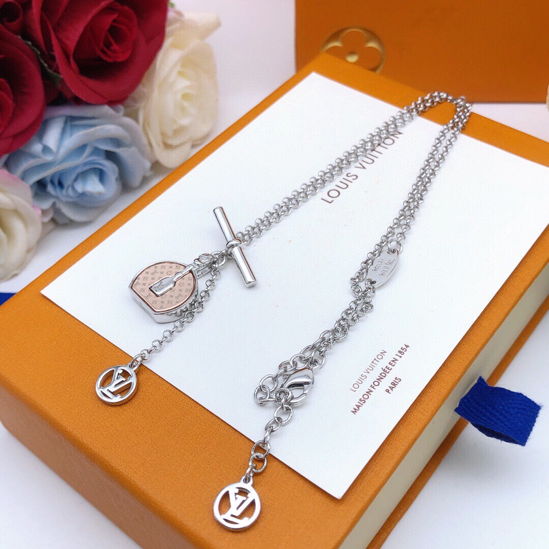 Martin Graham pendant necklace in polished metal-tone – side detail