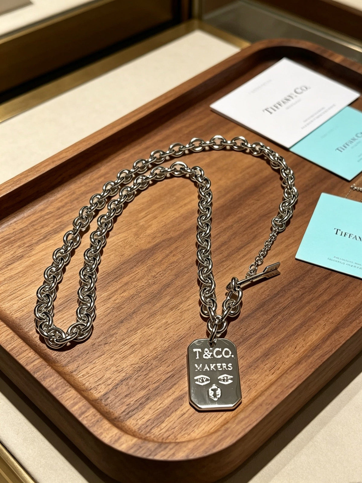 Martin Graham pendant necklace in polished metal-tone – side detail