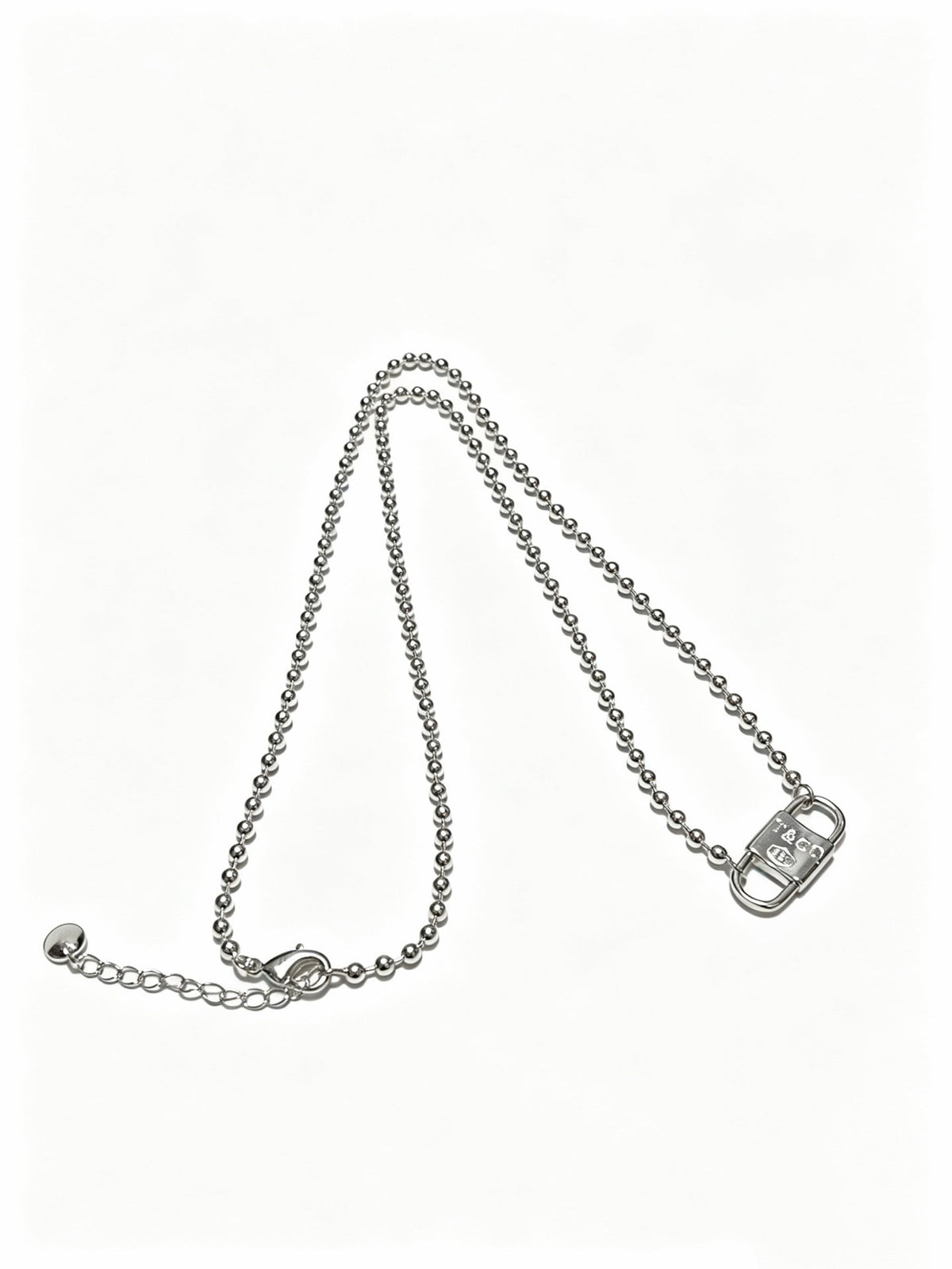 Martin Graham pendant necklace in polished metal-tone – side detail