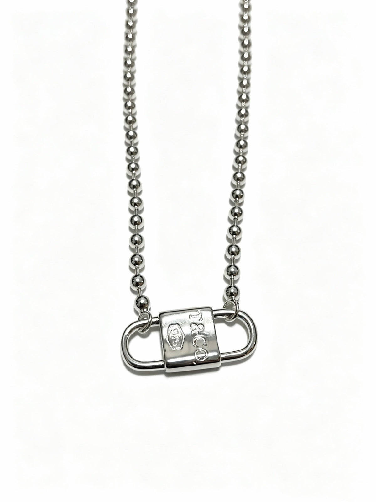 Martin Graham pendant necklace in polished metal-tone – detail view