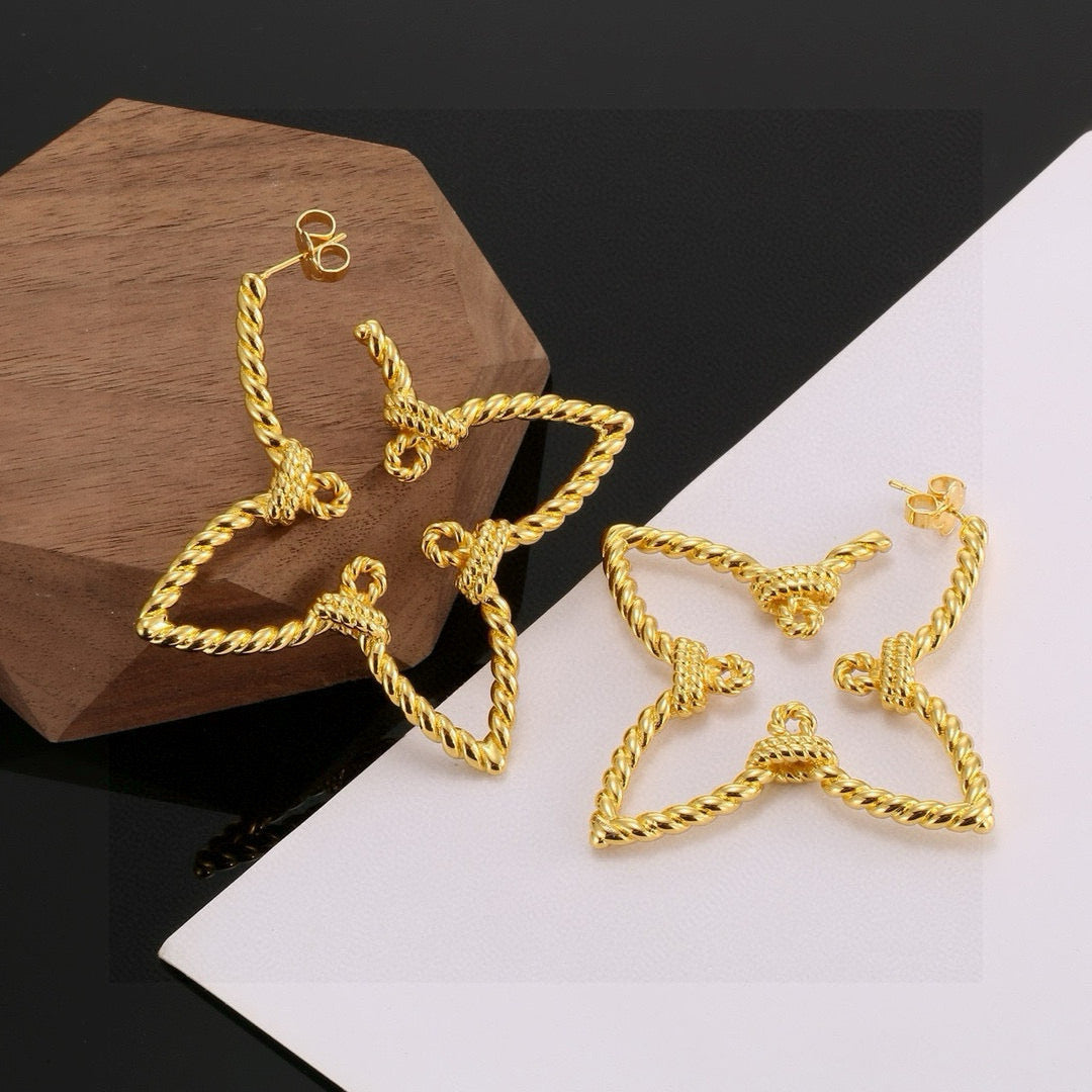 Martin Graham stud earrings in polished metal-tone – close-up detail