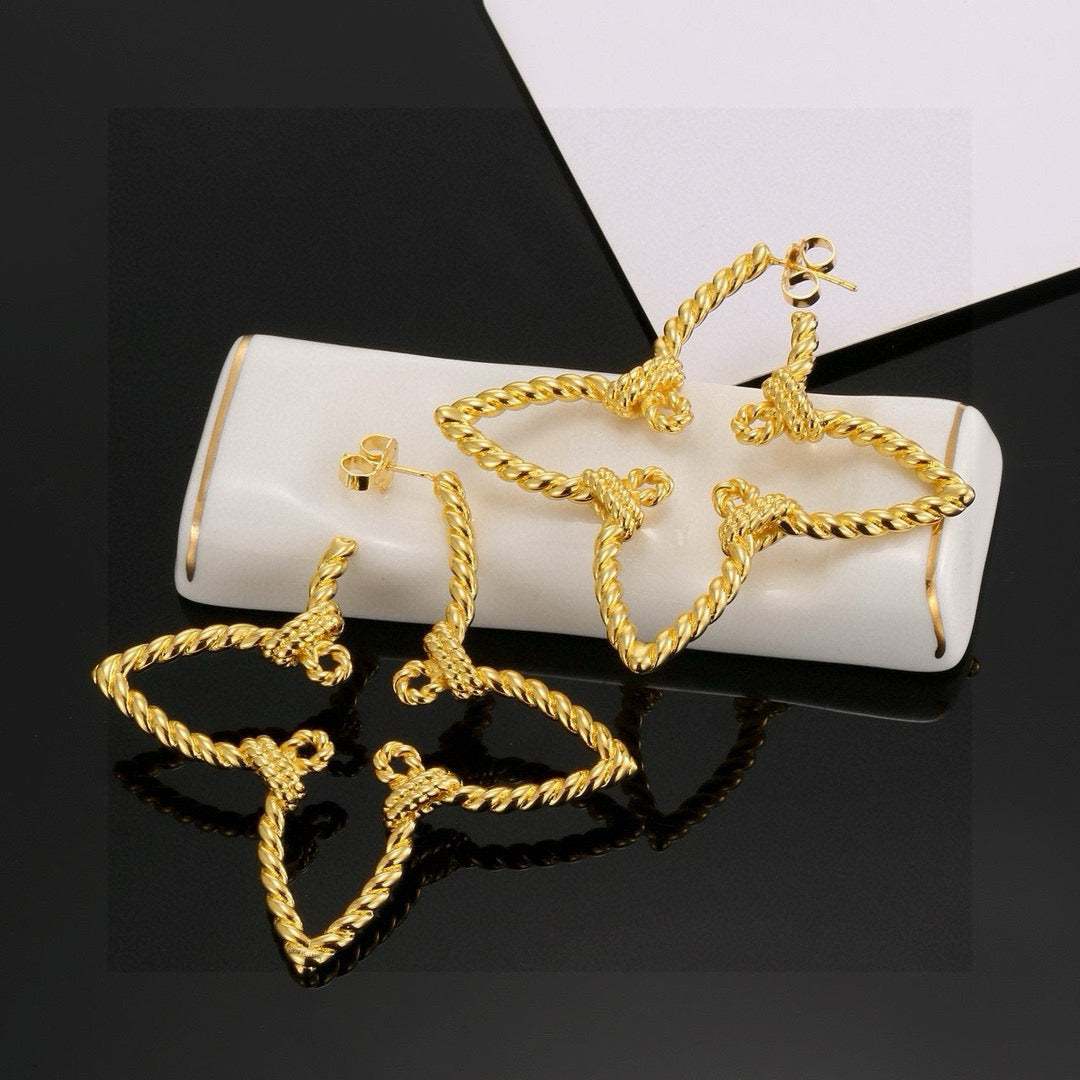 Martin Graham stud earrings in polished metal-tone – front product view