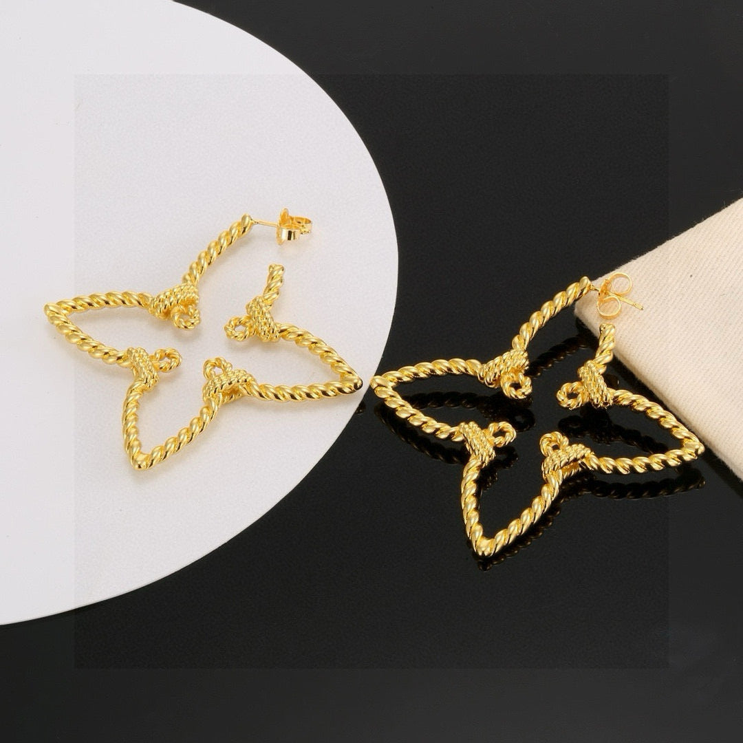 Martin Graham stud earrings in polished metal-tone – styled product view