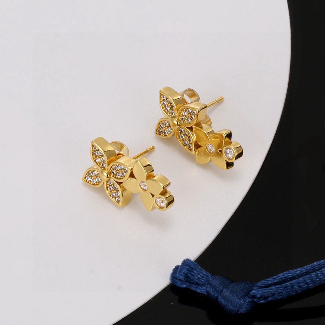 Martin Graham stud earrings in polished metal-tone – detail view