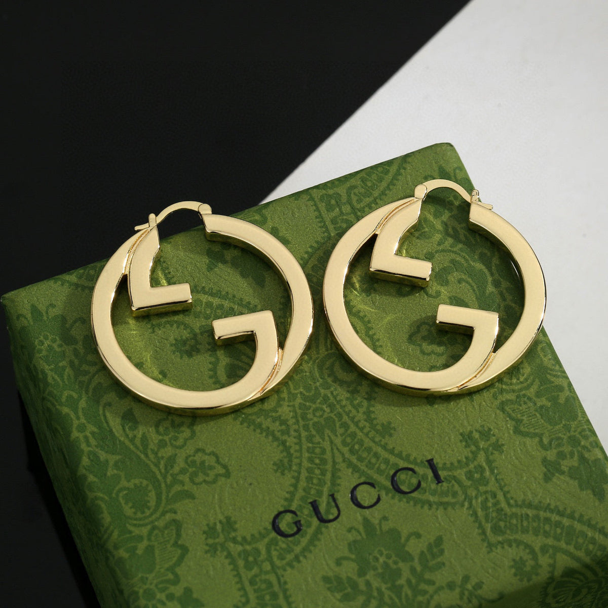 Martin Graham stud earrings in polished metal-tone – side detail