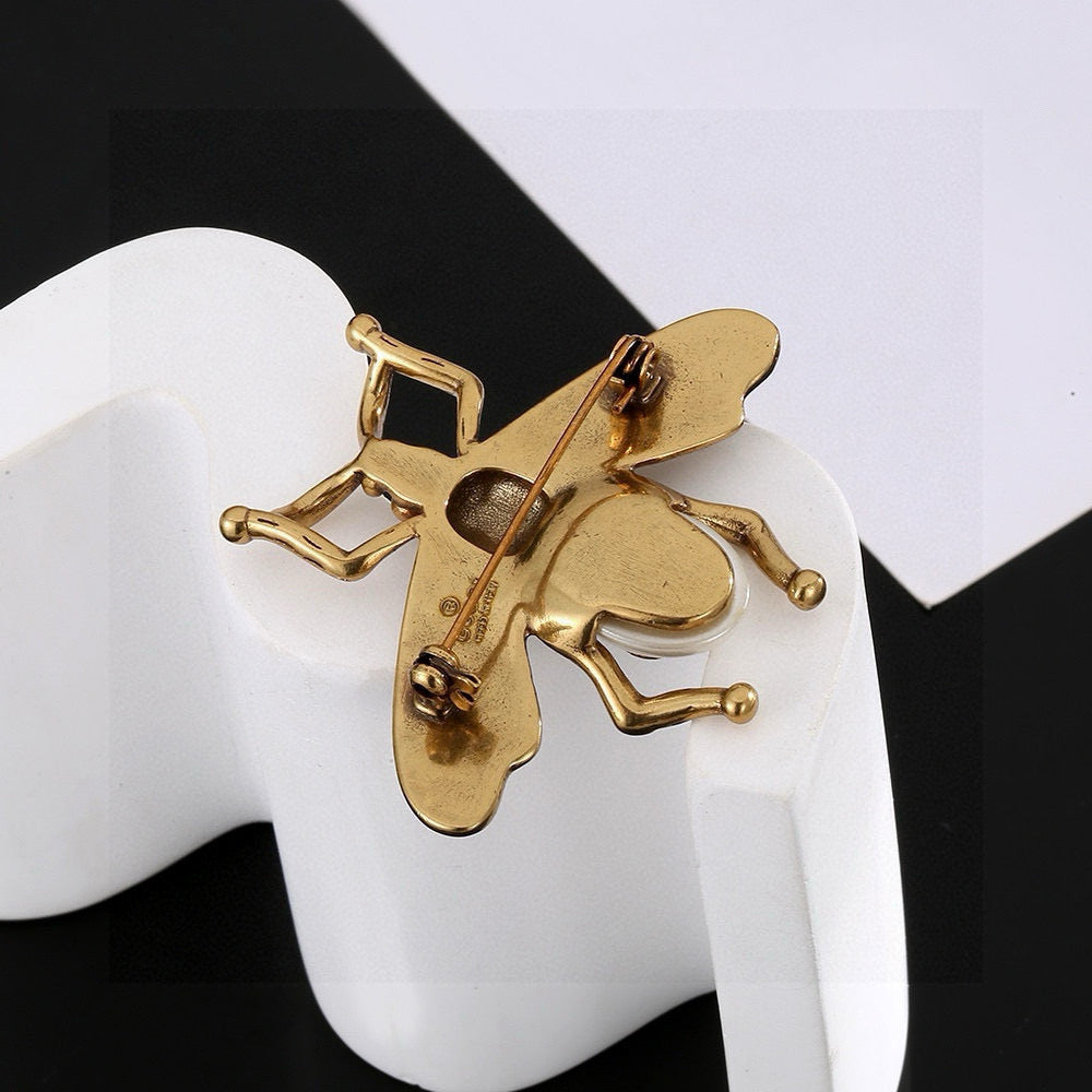 Martin Graham brooch in polished metal-tone – styled product view