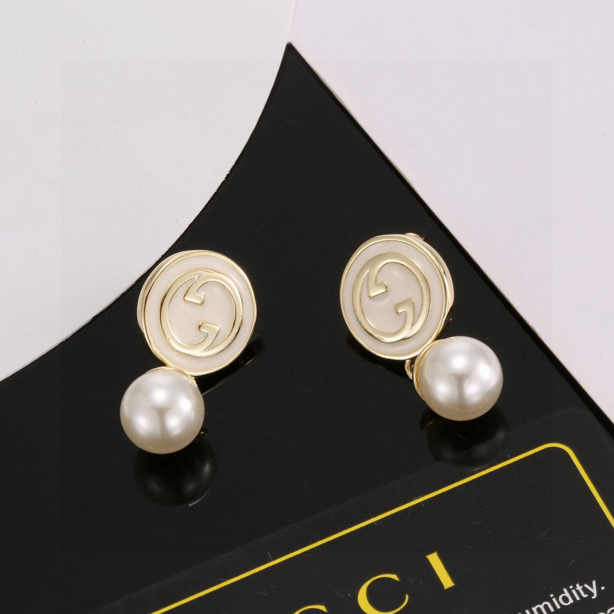 Martin Graham stud earrings in polished metal-tone – main product view