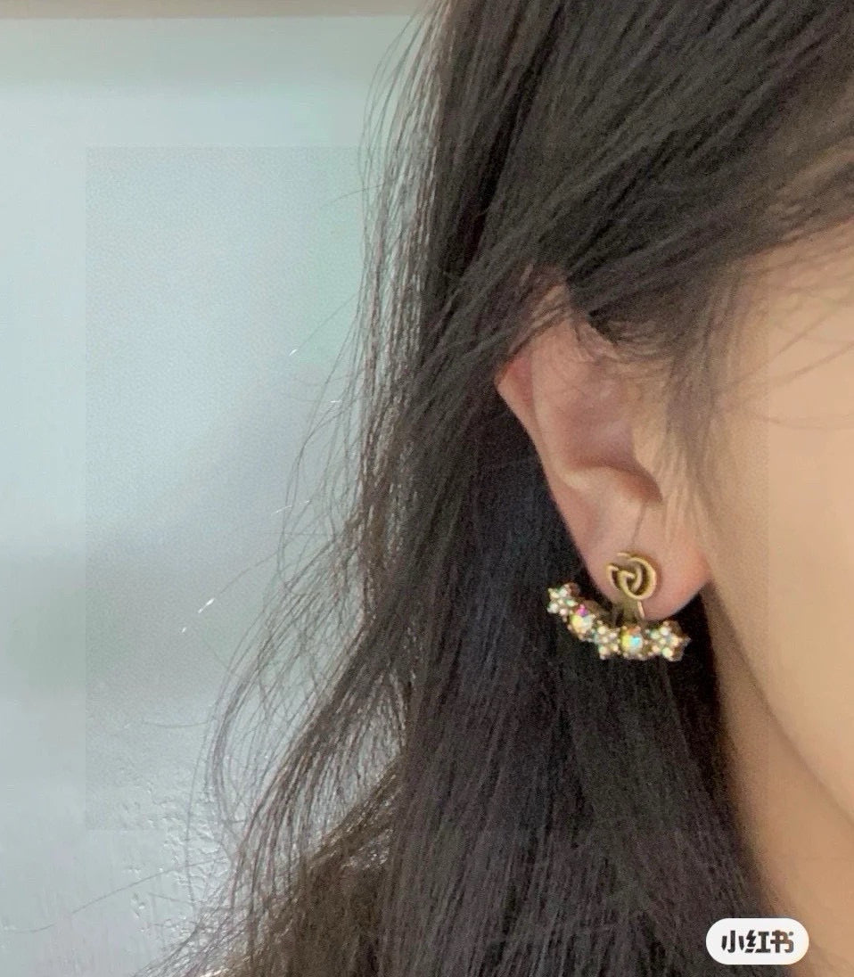 Martin Graham stud earrings in polished metal-tone – side detail