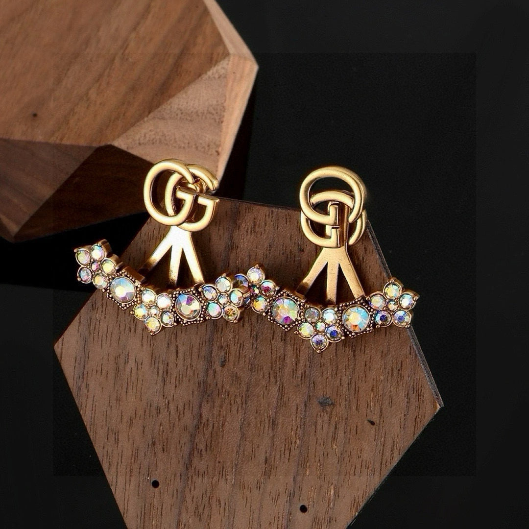 Martin Graham stud earrings in polished metal-tone – styled product view