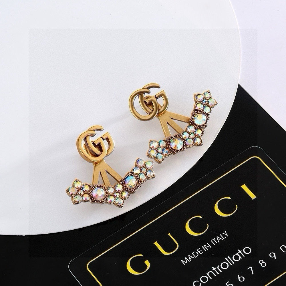 Martin Graham stud earrings in polished metal-tone – detail view
