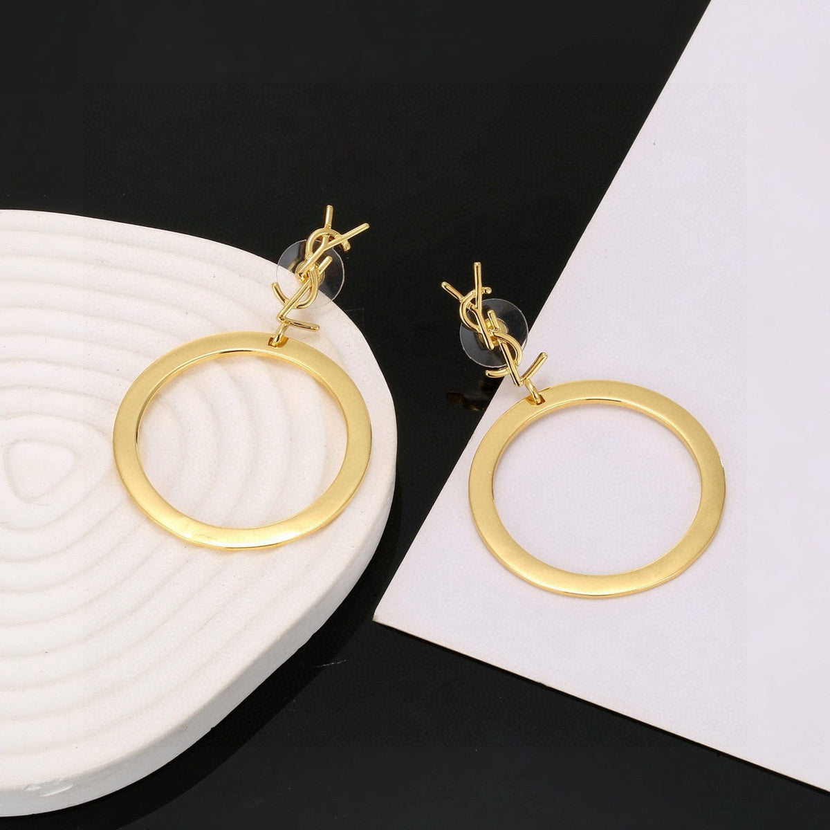 Martin Graham stud earrings in polished metal-tone – styled product view
