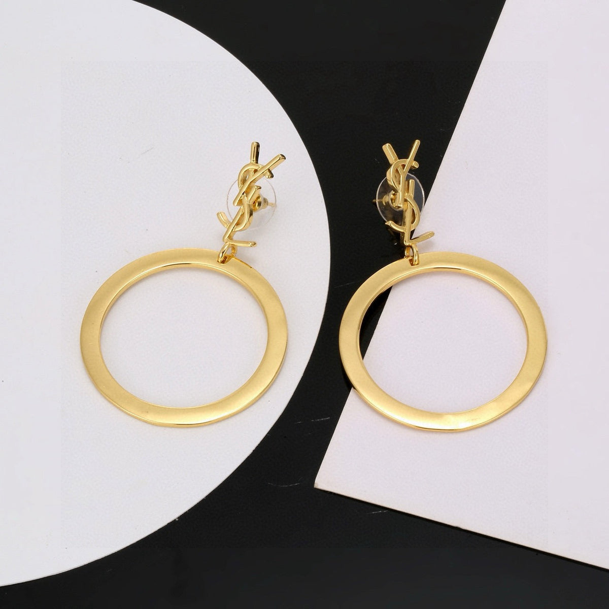 Martin Graham stud earrings in polished metal-tone – detail view