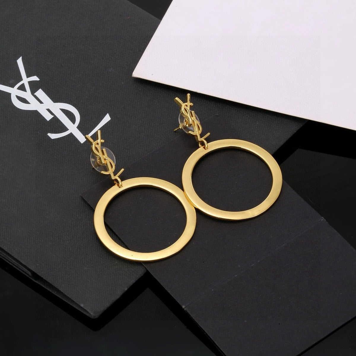 Martin Graham stud earrings in polished metal-tone – side detail