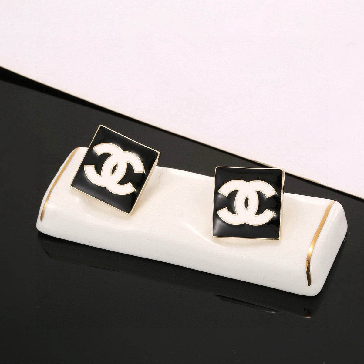 Martin Graham stud earrings in polished metal-tone – detail view