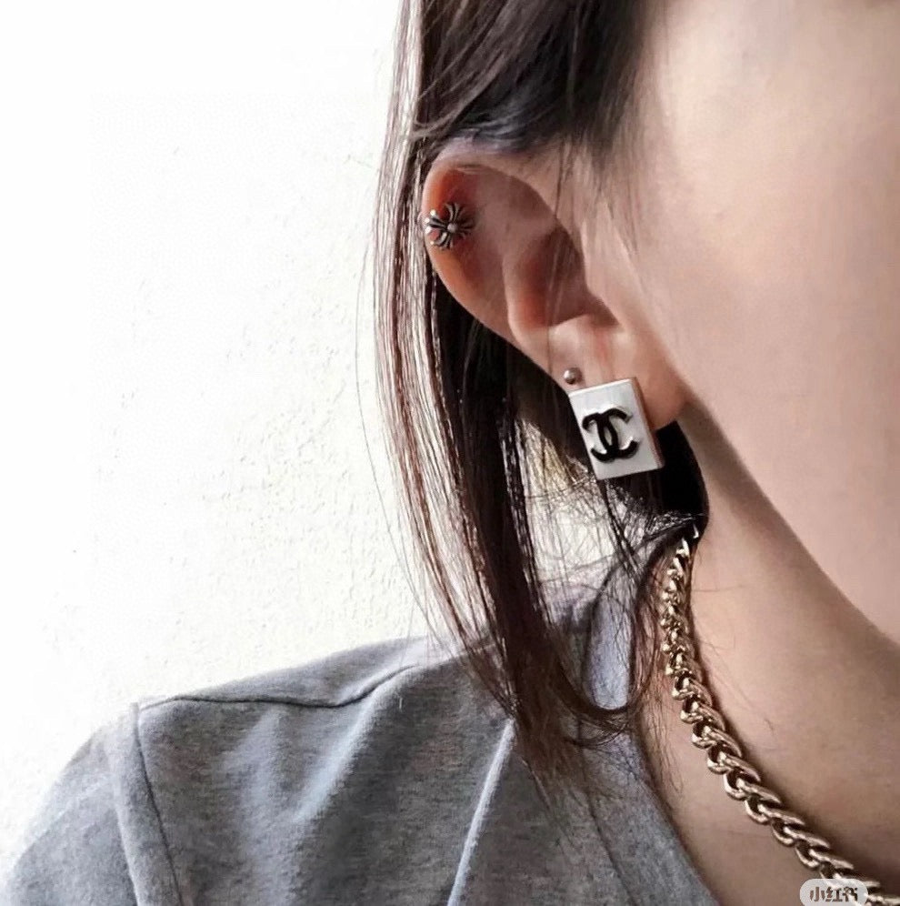 Martin Graham stud earrings in polished metal-tone – detail view