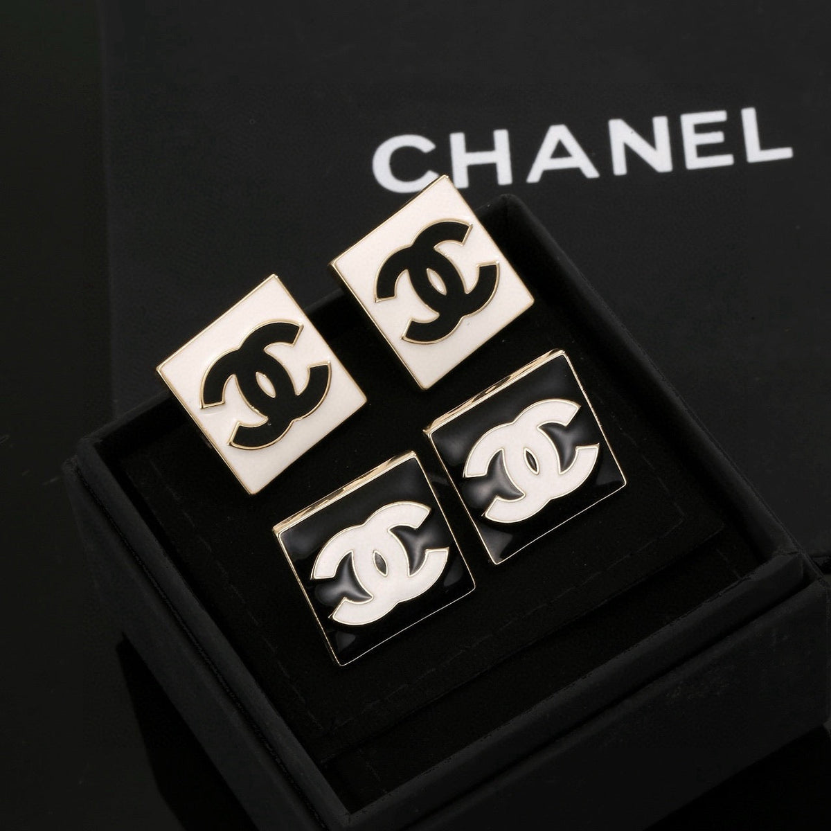 Martin Graham stud earrings in polished metal-tone – side detail