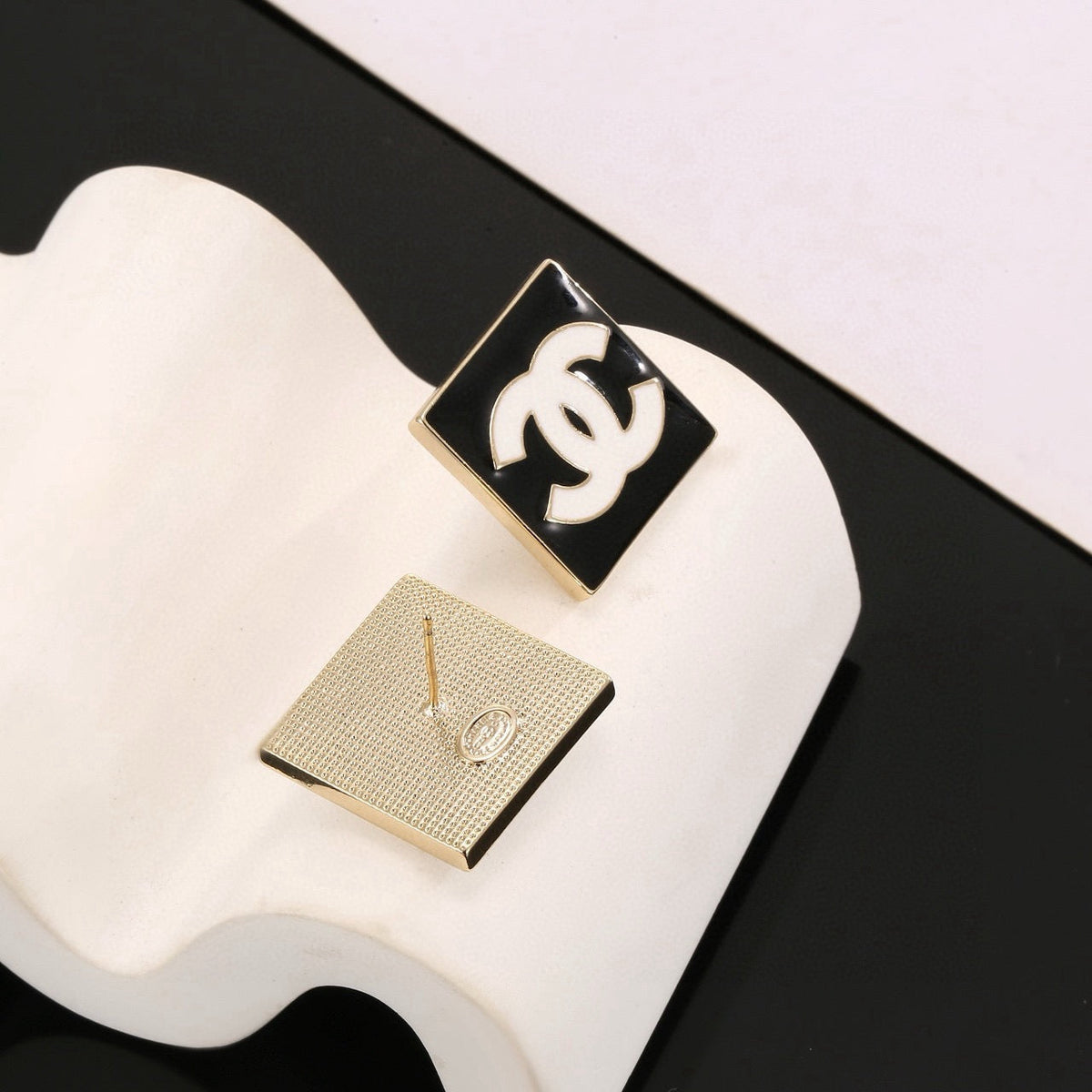 Martin Graham stud earrings in polished metal-tone – styled product view