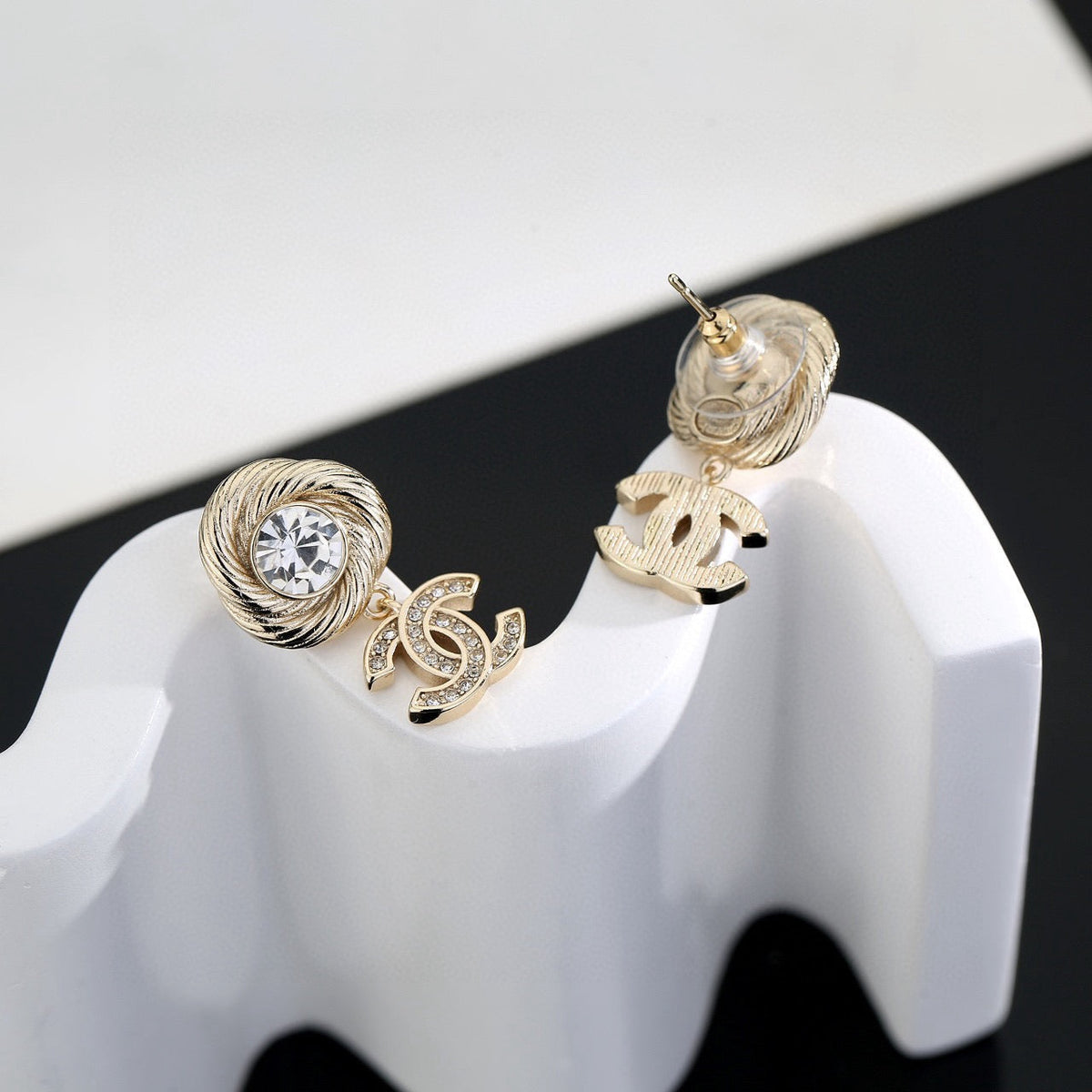 Martin Graham stud earrings in polished metal-tone – side detail